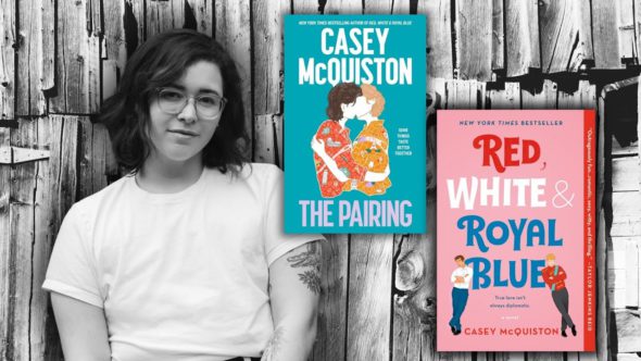 Author Casey McQuiston with shoulder length dark hair, glasses and a white tee. Features book covers of The Pairing and Red, White, & Royal Blue by Casey McQuiston.