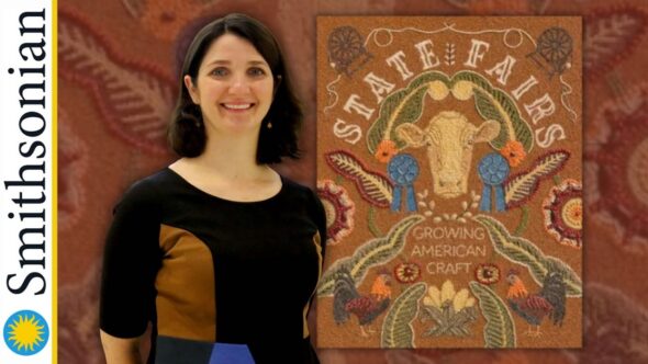 Brown embroidery background with author and Smithsonian Curator, Mary Savig, wearing a black dress with color blocks of brown and blue. She is smiling, with shoulder length dark hair. The book cover of State Fairs : Growing American Craft.