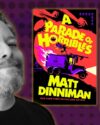 Author, Matt Dinniman, chin up smiling. He has a beard, short hair, and is wearing a black shirt. Purple background with various size darker dots. Book covers of Dungeon Crawler Carl and A Parade of Horribles by Matt Dinniman.